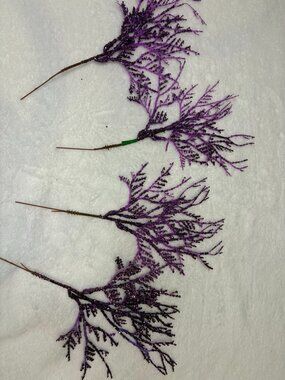 Set of four purple glitter plastic holiday picks